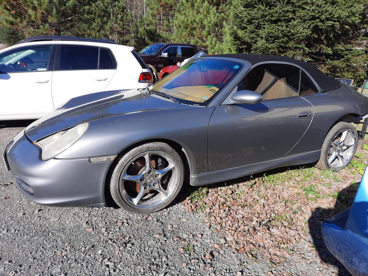 A Porsche parked outside the shop